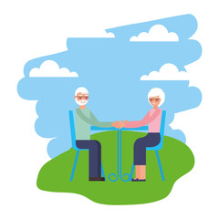 cute grandparents with tablet dining room in landscape