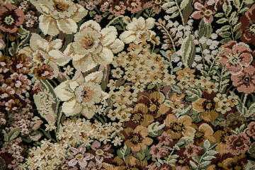 VintageTapestry background close-up of browns, orange and soft yellow flowers.   Texture.