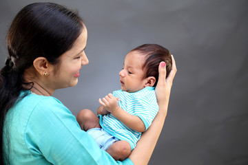 Newborn baby on hands mother  - 215450157