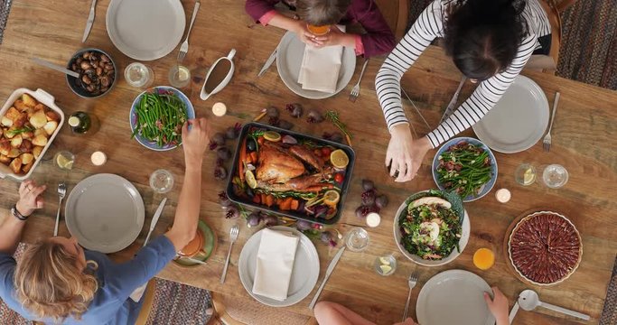 above view time lapse of family preparing table enjoying delicious thanksgiving meal together tasty homemade lunch camera rotate