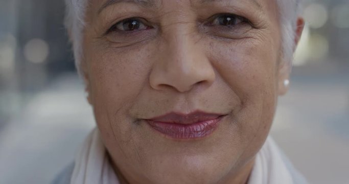 close up portrait senior indian business woman smiling enjoying successful lifestyle stylish mature female in city slow motion aging beauty