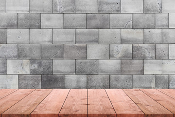 Empty wood table top and background of old stone brick wall - can used for display or montage your products.