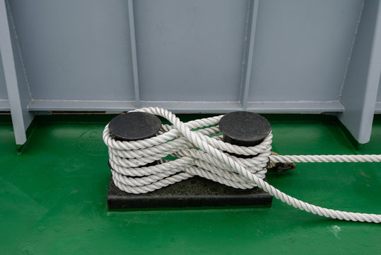 Mooring Bollard With A Fixed Rope On The Ship.