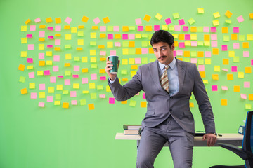 Businessman with many conflicting priorities   