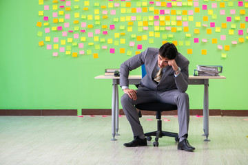 Businessman with many conflicting priorities   