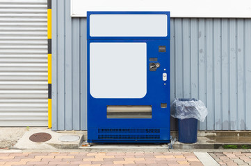 Empty white shelves of standard office vending machine