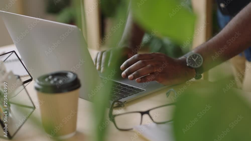 Wall mural businessman hands typing using laptop keyboard drinking coffee beverage sending email message browsi