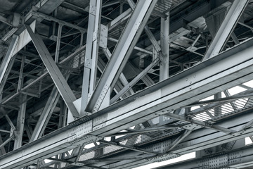 framework detail of metal railroad bridge. closeup bottom view