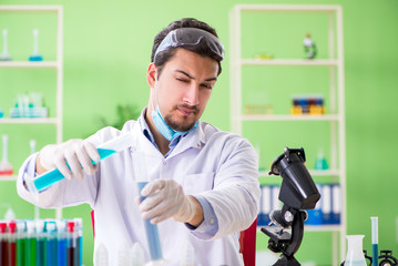 Man chemist working in the lab