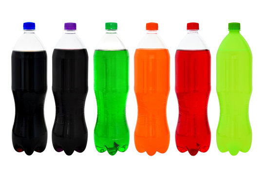 close up set of plastic bottle of tasty colorful soft drink (cola, purple grape, green cream soda, orange, red strawberry and lemon-lime flavors) isolated on white background