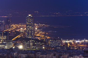 Fototapeta na wymiar Barcelona cityscape at night, marina port view