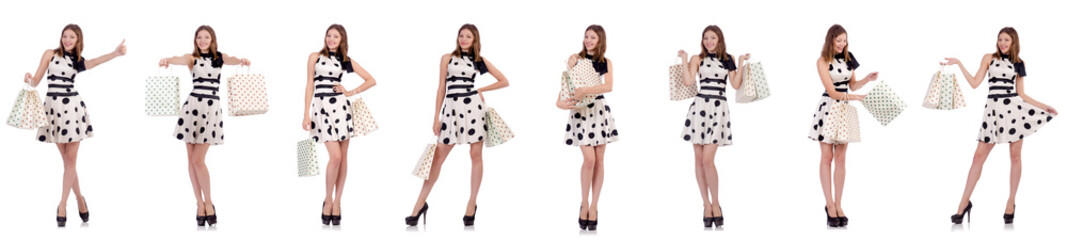 Naklejka premium Young woman with shopping bags on white