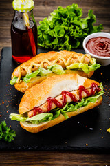 Hot dogs and french fries on cutting board