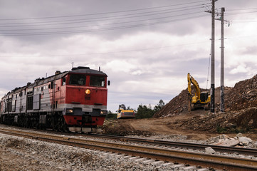 Fototapeta na wymiar Cargo trains on the railway on the Baikal area of the Amur Railway