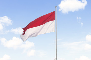 Indonesia flag with blue sky background