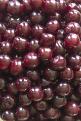 Cooking cherry jam.Wet deep red  ñherries  as a background. Site about fruits, berries, food, cooking and cooking.