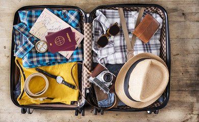 Preparing travel suitcase high angle view