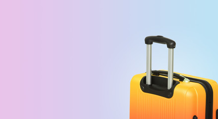 Colorful horizontal banner with suitcase and copyspace. Travelling concept.