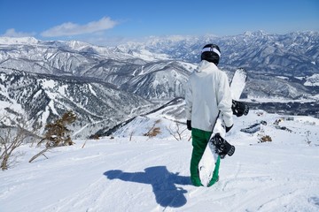 Fototapeta na wymiar Panoramic snow boarding at hakuba happo in Nagano Japan with blue