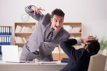 Angry boss shouting at his employee