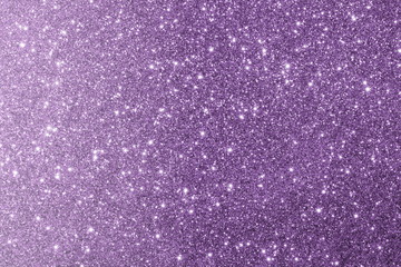  красивый фиолетовый фон из блесток с бликами и боке         