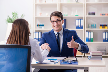 Man signing medical insurance contract