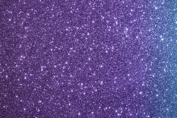  красивый фиолетовый фон из блесток с бликами и боке         