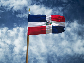 Dominicana flag Silk waving flag of Dominican Republic made transparent fabric with wooden flagpole gold spear on background blue sky white smoke clouds retro photo Countries of world 3d illustration