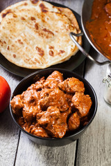 Chicken tikka masala served with bread naan
