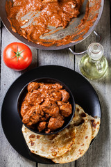 Chicken tikka masala served with bread naan