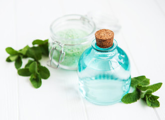 essential aroma oil with massage salt and mint