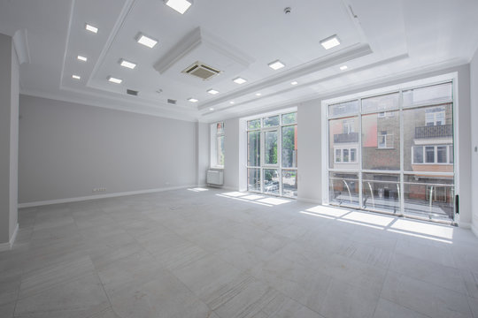 Spotlight and empty space, Empty space, the interior of an office or apartment with three windows , the interior is in light colors