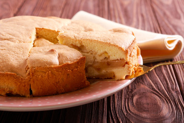 Soft apple cake, sliced on plate