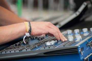 closeup of hands of mixer at concert in outdoor