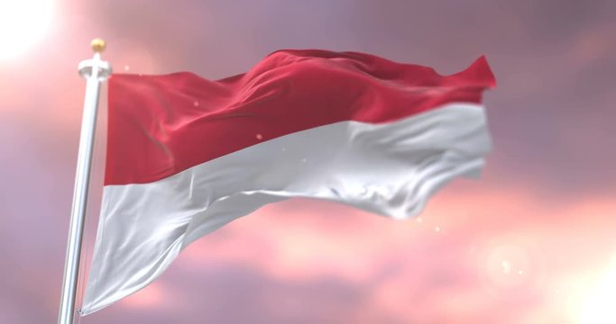 Flag of Monaco waving at wind in slow at sunset, loop