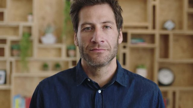 portrait of serious startup businessman looking pensive staring at camera