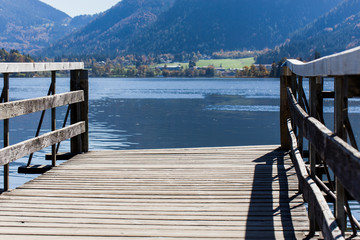 Empty wooden jetty in a mountainous landscape on a lake
