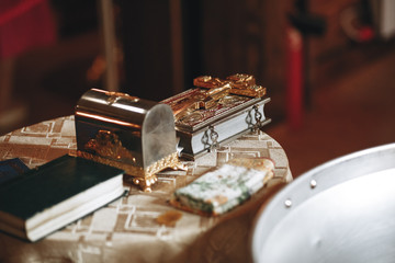 the Holy father is preparing for the baptism of the baby in the Church.