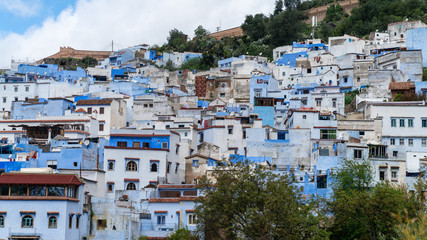 Fototapeta premium Chefchaouen panorama, blue city skyline on the hill, Morocco