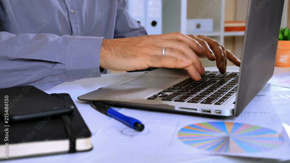 Poster unrecognizable worker surfing internet on computer