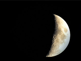 Crescent moon over the town of Hurden, Schwyz, Switzerland