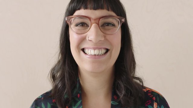 portrait of confident business woman laughing close up trendy glasses