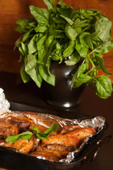 Roasted meat and basil in vase