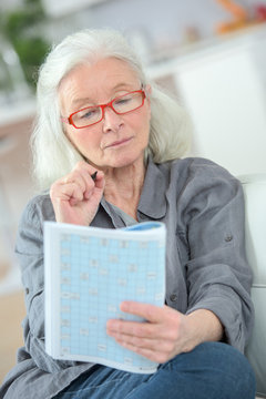 elderly woman reading book