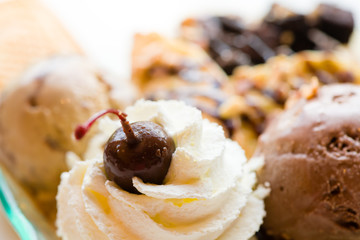 tasty pancakes with chocolate ice cream crispy waffle whipped cream with brownies cherry almond and chocolat syrup on top.served pancakes crepes on plate.sweets dessert brownies pancakes crepes.