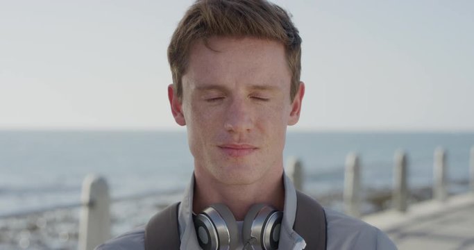 Portrait Attractive Young Man Student Looking Serious Confident Male Red Head Teenager Relaxing On Warm Seaside Slow Motion