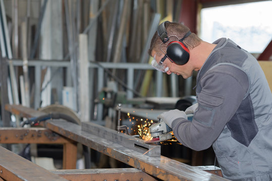 Man Angle Grinding Metal