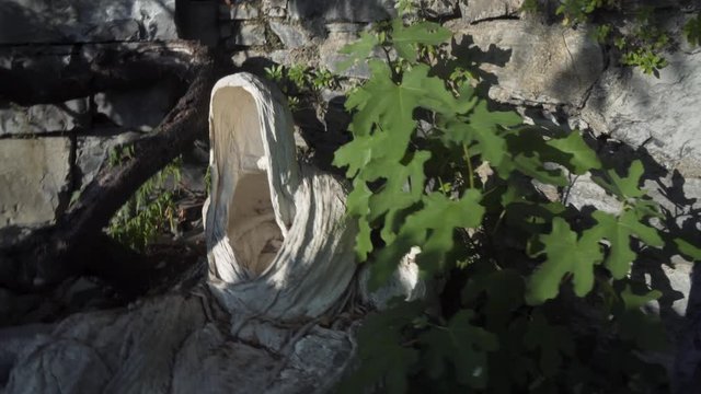 vezio castle, view over the lake and the alps mountains , inside of the old stone castle there are lot of sculpture of gosth
