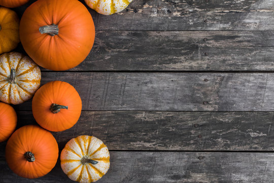 Pumpkins on wooden background