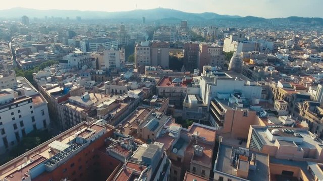 Top down footage of large church and surrounding buildings. Cathedral of Barcelona with gothic tower. Barcelona, Spain